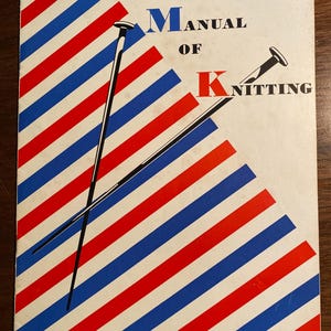 May include: A vintage book cover with a red, white, and blue striped background. The title is "Beginner's Manual of Knitting" with the letters "B", "M", and "K" in large, bold font. Two knitting needles are crossed in the center of the cover.