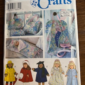 May include: Simplicity Crafts sewing pattern 9833. The pattern features various doll clothing and accessories, including a doll carrier, sleeping bag, and dresses. The pattern also includes doll clothing such as a yellow raincoat, red cape, and blue coat.