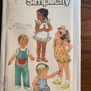 May include: A sewing pattern for children's clothing. The pattern includes three different designs: a watermelon print overall, a floral print overall, and a striped overall. The pattern is for sizes 2-4.