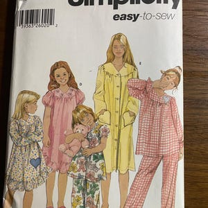 May include: Simplicity sewing pattern K5 5941, featuring illustrations of girls in various sleepwear styles. The pattern includes sizes 7, 8, 10, 12, and 14. The packaging is white with black text and illustrations.