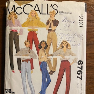 May include: A vintage McCall's sewing pattern for women's pants. The pattern is for sizes 6-8-10 and includes five different styles of pants. The pattern is from the Norton Simon Inc. Company and costs $2.00.