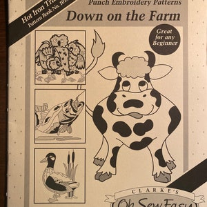 May include: A book cover for punch needle embroidery patterns titled "Down on the Farm". The cover features a black and white illustration of a cow, a fish, a duck, and three owls. The book is part of the "Oh Sew Easy" punch embroidery pattern series.