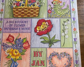 May include: A colorful illustration titled "The Posie Patch" featuring a variety of floral designs. The artwork includes a basket of flowers, a caterpillar, a red rose, a bouquet, and a heart-shaped floral arrangement. The text reads "A Big Bouquet of Flower Patterns & More".