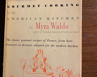 May include: The Complete Book of Gourmet Cooking for the American Kitchen by Myra Waldo, author of "Complete Round the World Cook Book". The classic gourmet recipes of France, from hors d'oeuvres to desserts, adapted for the modern kitchen. The cover features a red and white illustration of a dessert platter with a glass of wine.
