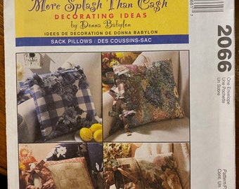 May include: McCall's pattern envelope featuring "More Splash Than Cash" decorating ideas by Donna Babylon. The envelope showcases images of decorative sack pillows with various floral and patterned designs. The price is $11.95.