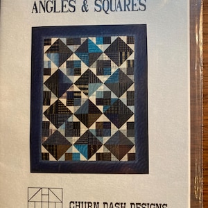 May include: A quilt pattern booklet titled "Angles & Squares" by Churn Dash Designs. The cover features a quilt design with a blue, black, and white color scheme.