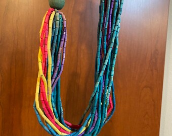 Wood Beaded Necklace 13" long - Multicolored (Red / Teal / Yellow) strings of wood oblong beads on front, around neck is simple beads