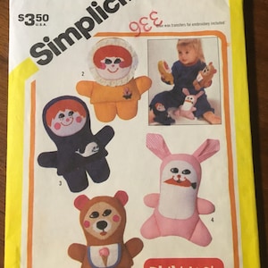 May include: A vintage Simplicity sewing pattern featuring several stuffed animal designs, including a bear, a bunny, and a doll. The pattern includes the text "ONE SIZE" and "PLAYSKOOL". The pattern is in a yellow and white color scheme.