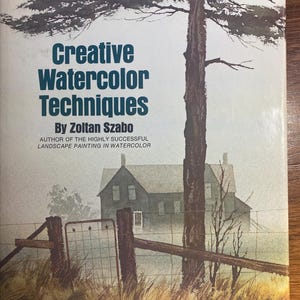 Può includere: Copertina del libro "Creative Watercolor Techniques" di Zoltan Szabo. L'immagine presenta un acquerello di una casa, una recinzione e un albero. Il libro è una guida didattica per la pittura ad acquerello.