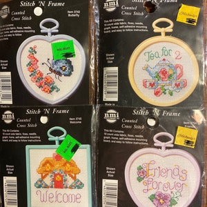 May include: Four counted cross stitch kits with colourful embroidery designs. The kits include aida fabric, floss, needle, graph, frame, self-adhesive mounting board, and easy to follow instructions. The designs include a butterfly, a teapot, a house, and a heart with the words "Friends Forever".
