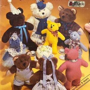 May include: A vintage book cover titled "Teddy Bears to make and love" featuring illustrations of nine teddy bears in various outfits. The bears are brown, white, yellow, and blue, with accessories like hats and dresses. The cover is yellow with text.
