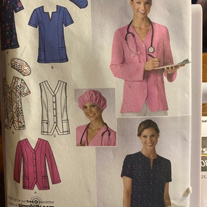 May include: A sewing pattern for medical scrubs and jackets. The pattern includes various styles of tops, jackets, and a cap. The image features a woman wearing a pink jacket and a stethoscope. The pattern is designed by Karen Z.