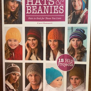 May include: A softcover knitting book titled More Than a Dozen HATS & BEANIES by Carri Hammett. The cover features photographs of various people wearing different knitted hats and beanies in colors like yellow, orange, blue, and brown.