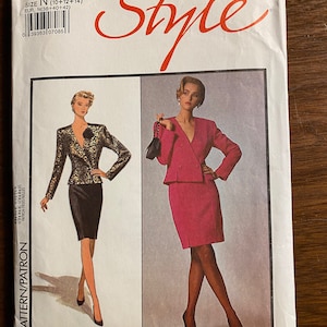 May include: A sewing pattern for a skirt suit with a personalized fit. The pattern is for sizes 10, 12, and 14. The pattern is by Bruce Oldfield for Style.