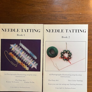 May include: Two books titled "Needle Tatting" with a colorful tatting design on the cover of each book. Book 1 is titled "The Easy Art" and Book 2 is titled "Two Color Tatting".