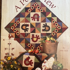 May include: A book cover titled "A Pot of Stew" featuring a patchwork quilt design with various fabric patterns and appliqued shapes. The image includes a metal bucket with vegetables, rooster figurines, and the text "Scraps of Time."