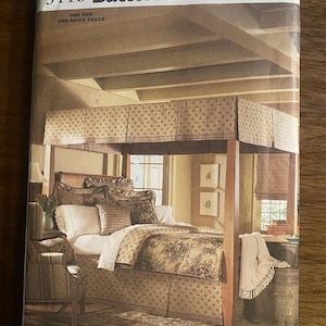 May include: A Butterick Waverly 3116 sewing pattern envelope featuring an illustration of a four-poster bed with a floral canopy, bed skirt, and matching bedding. The image displays a bedroom setting with a chair, pillows, and a throw blanket.