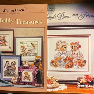 May include: Two cross-stitch pattern books from Stoney Creek Collection. The first book is titled "Teddy Treasures" and features a variety of teddy bear designs. The second book is titled "Boyds Bears and Friends" and features a cross-stitch pattern of two bears sitting together.