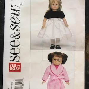 May include: A sewing pattern for making clothes for dolls. The pattern is for a white dress with a black bodice and a pink robe. The pattern number is B5414 and the text "see & sew YES! it's easy" is printed on the pattern.