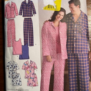 May include: A sewing pattern for pajamas with a plaid and floral design. The pattern includes instructions for making a shirt, pants, and a top. The pattern is for sizes small, medium, and large.