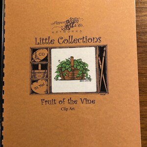 May include: A brown booklet with the title "Little Collections" and the words "Fruit of the Vine" and "Clip Art". The cover features a drawing of a basket of green leaves and a small heart with the words "It's Me!" on it.