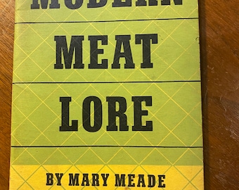 May include: A green book with the title "MODERN MEAT LORE" by Mary Meade, Chicago Tribune Cooking Editor.