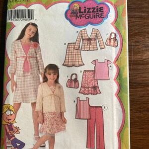 May include: Simplicity sewing pattern number 4669 for girls sizes 7-14. The pattern includes instructions for making a cardigan, skirt, top, and pants. The pattern is for the Lizzie McGuire television show.