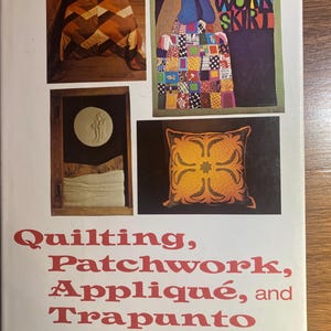 May include: Book cover featuring images of quilts and patchwork designs. The title reads "Quilting, Patchwork, Appliqué, and Trapunto" by Thelma R. Newman. Includes images of a quilt on a bed, a patchwork skirt, and a decorative pillow.