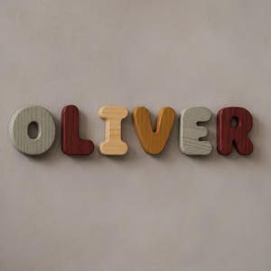 May include: A set of six individual wooden letters spelling the name OLIVER. The letters are finished in various colors including sage green, deep maroon, natural light wood, and mustard yellow, each featuring a distinct wood grain texture.