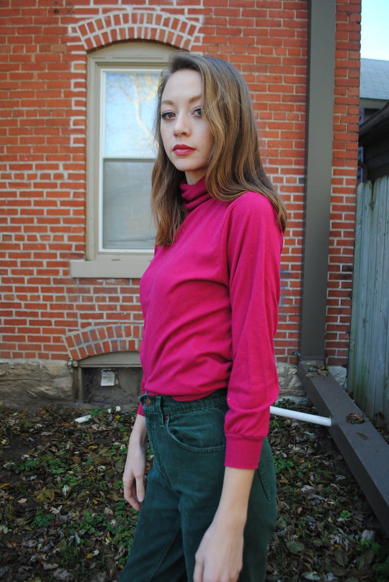 bright pink turtleneck