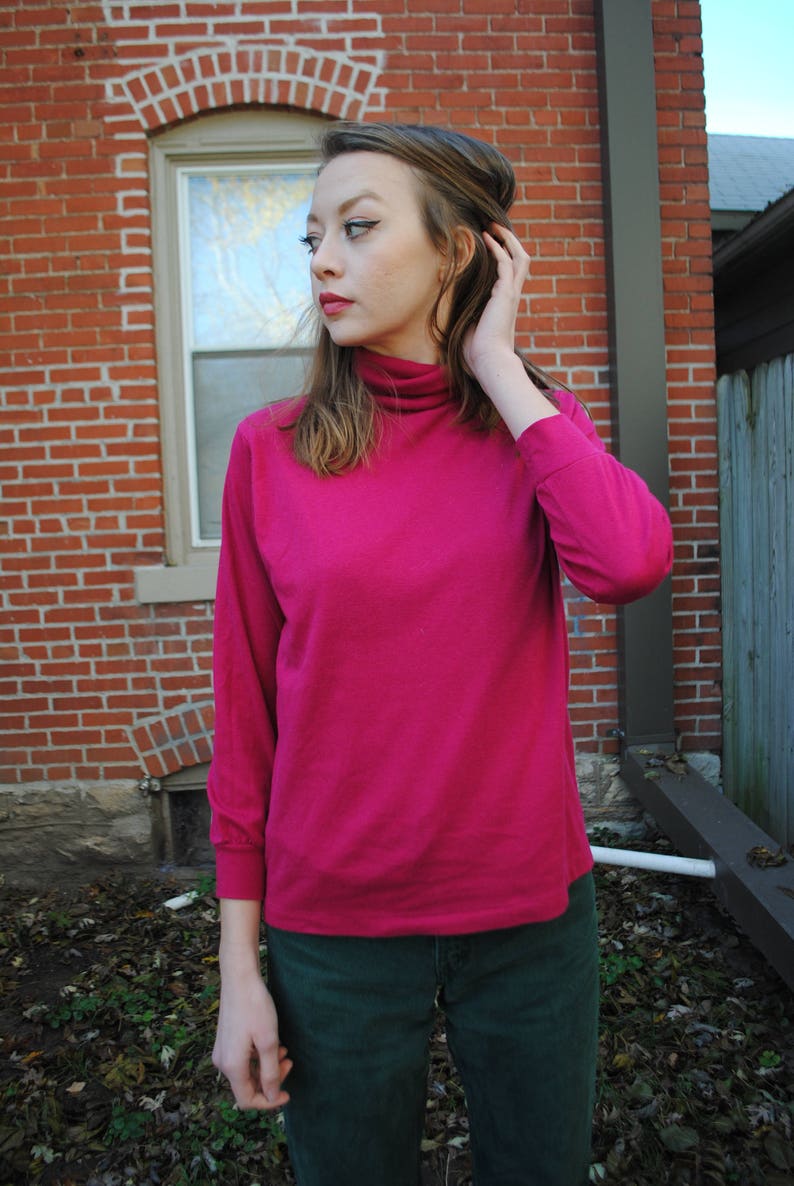 bright pink turtleneck