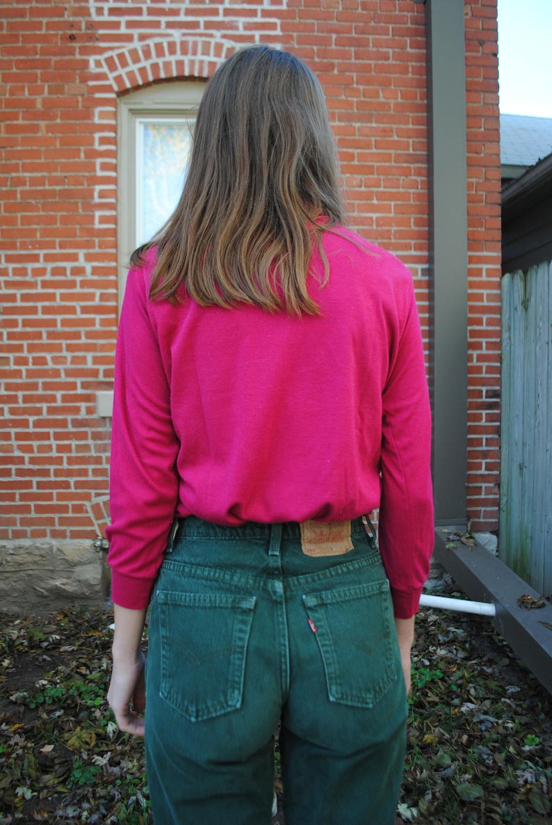 bright pink turtleneck