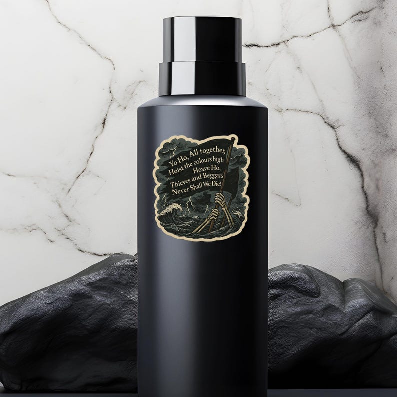 May include: A black water bottle with a silver cap. The bottle features a sticker with a pirate-themed design, including a black flag, skeleton hands, and the text "Yo Ho, All together, Hoist the colours high, Heave Ho, Thieves and Beggars Never Shall We Die!"
