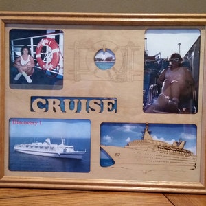 May include: A wooden picture frame with a cruise ship theme. The frame has four photos, one of a life preserver, one of a woman on a ship, one of a ship called "Discovery 1", and one of a ship with the text "CRUISE" carved into the wood.