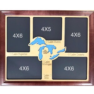 May include: A wooden photo frame with spaces for five pictures. The frame has a dark brown border and a light brown center with a blue map of the Great Lakes. The photo openings are labeled 4x6 and 4x5.