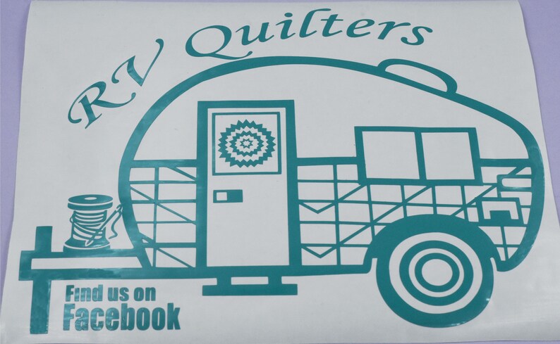 May include: Teal blue vinyl decal of an RV camper with the text "RV Quilters" above it and "Find us on Facebook" below it. The camper has a window with a quilt design and a spool of thread on the side.
