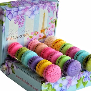 May include: A box of colorful macarons with a floral design and the text "Leila Love Macarons" and "www.leilalove.com".