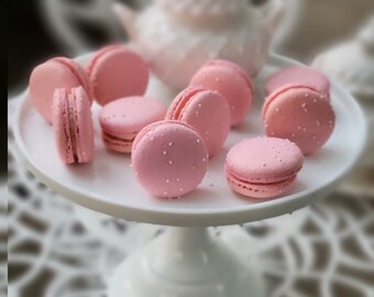 15 Pink strawberry cream Macarons with white sprinkles on top