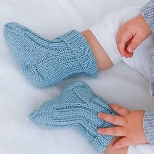 Knitted Socks for Baby and Children in Merino blue. Piece is knitted in Rib.