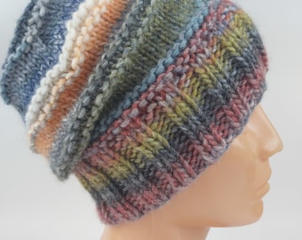 May include: A colorful knitted beanie hat with stripes of blue, green, orange, and red. The hat is made of a soft, textured yarn.