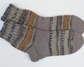 May include: A pair of grey, brown and blue striped knitted socks.
