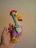 Crochet Rooster Amigurumi: Colorful Stuffed Chicken Toy product logo