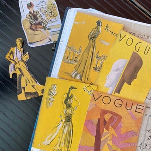 May include: A vintage Vogue magazine cover with a yellow background and a woman in a brown and yellow dress. The magazine cover text reads "Vogue" in large, bold letters.