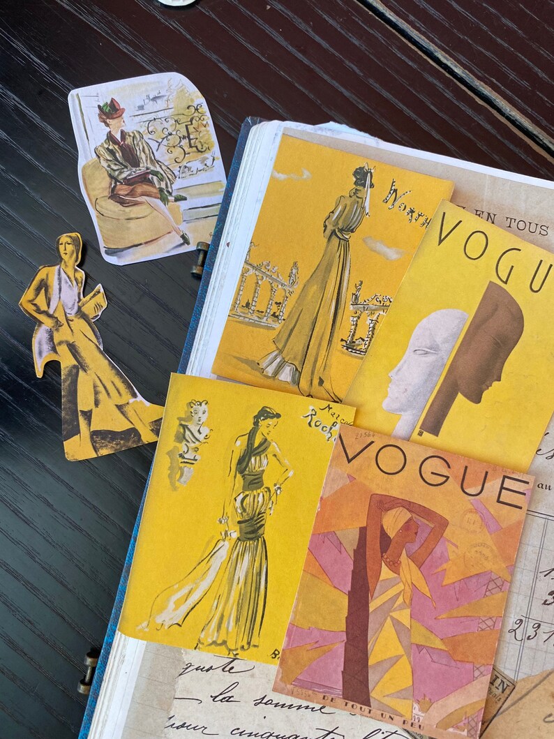 May include: A vintage Vogue magazine cover with a yellow background and a woman in a brown and yellow dress. The magazine cover text reads "Vogue" in large, bold letters.
