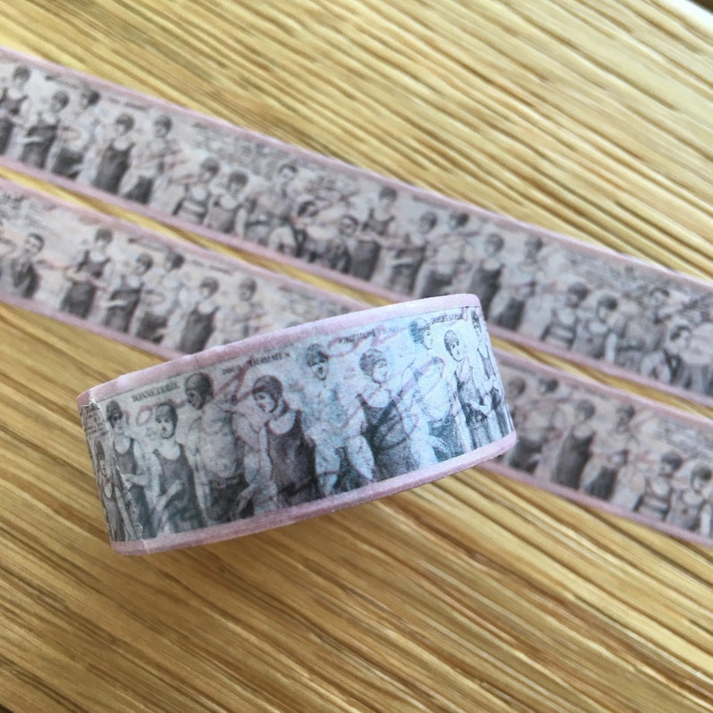 May include: Pink washi tape with a vintage design of women in swimsuits. The tape has a repeating pattern of women in swimsuits from the 1920s.