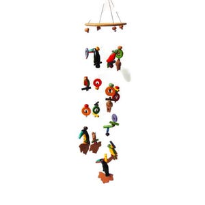 May include: A colorful, handcrafted mobile featuring whimsical bird figures. The mobile is suspended from a wooden ring and includes various bird designs in shades of red, green, yellow, and brown. A decorative piece for a nursery or child's room.