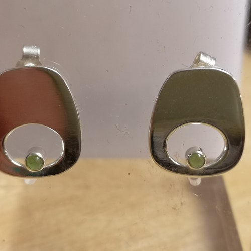 Green eye studs made from Silver and set with orders jade