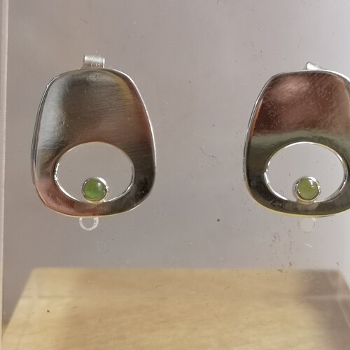 Green eye studs made from Silver and set with orders jade