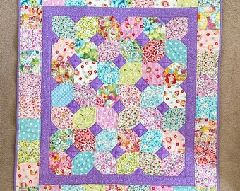 Pastel lilac pink lap quilt blanket with dimple plush fleece backing