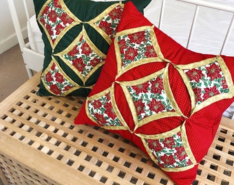 A pair of Christmas cathedral window cushion pillow covers